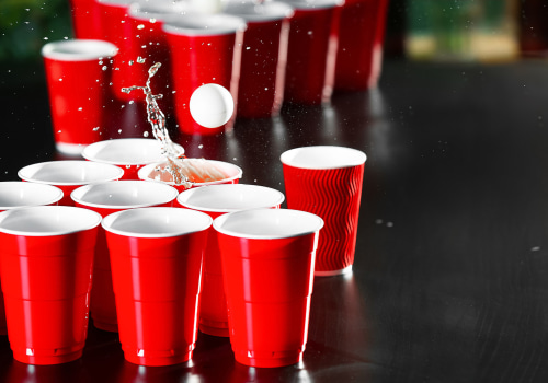 Are there any special rules for playing beer pong with different types of lighting or music in the room or area where the game is being played?